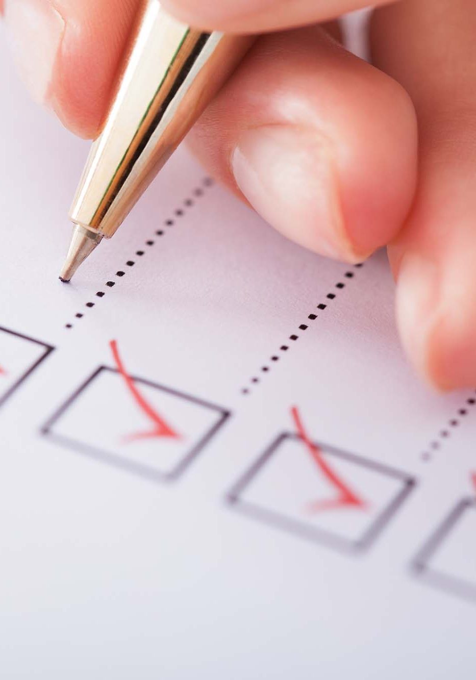 Cropped image of businesswoman writing on checklist